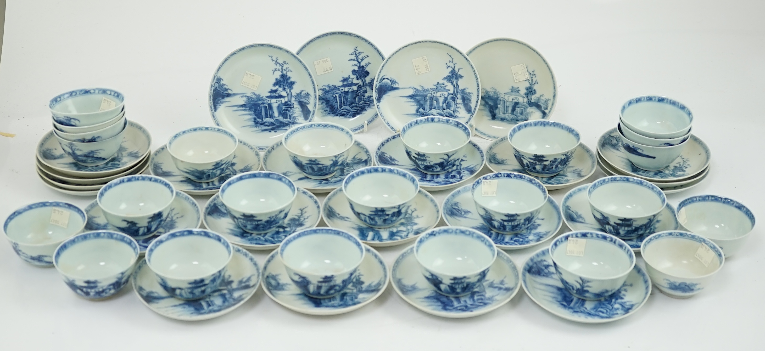 A set of twenty four Chinese Nanking Cargo blue and white ‘large pagoda’ tea bowls and saucers, Qianlong period